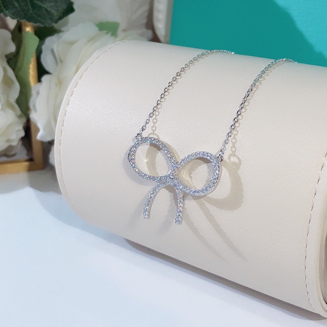 [Stellar jewels]CLAW SET RHODIUM PLATED BOW NECKLACE