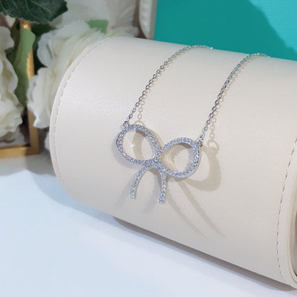 [Stellar jewels]CLAW SET RHODIUM PLATED BOW NECKLACE