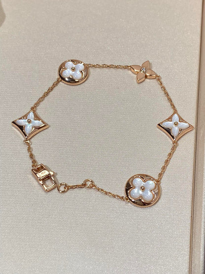 [Stellar Jewelry]STAR AND SUN 5 MOTIF MOP PINK GOLD BRACELET