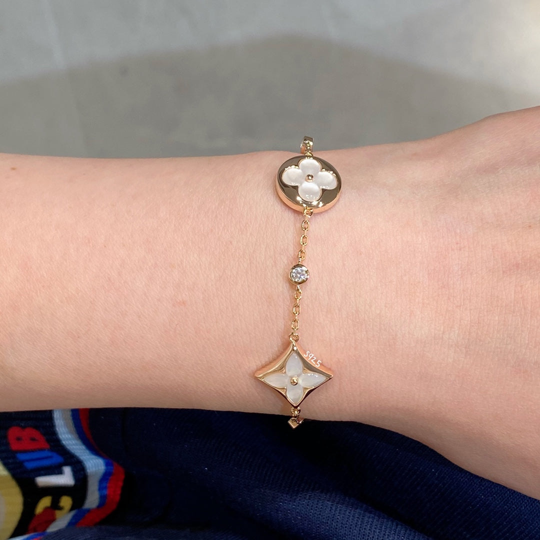 [Stellar Jewelry]STAR AND SUN 4 MOTIF WHITE MOP PINK GOLD BRACELET